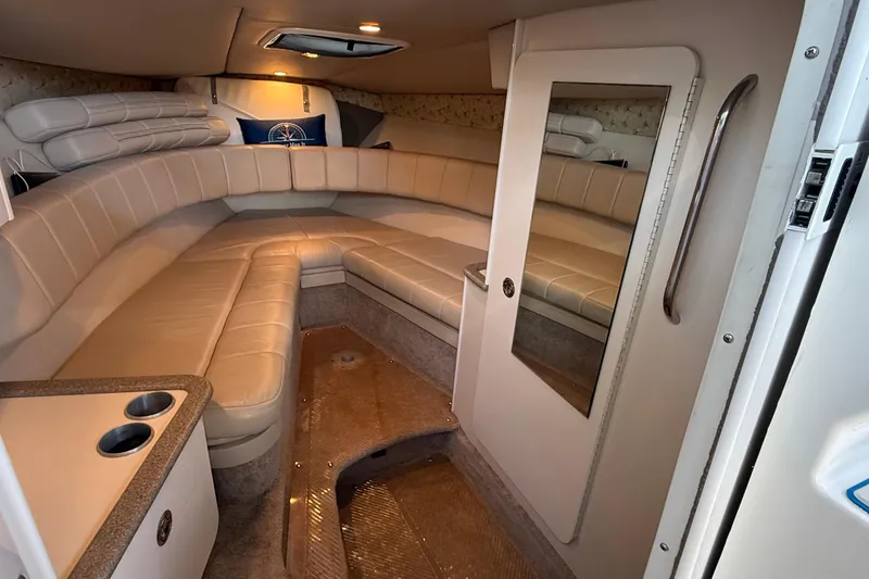 Slide: The Image of 1999 Formula 280 Sun Sport boat interior with seating and sink area. - 14