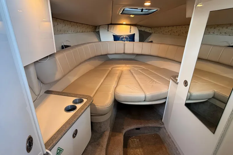 Slide: The Image of 1999 Formula 280 Sun Sport cabin interior with beige seating and compact amenities. - 16