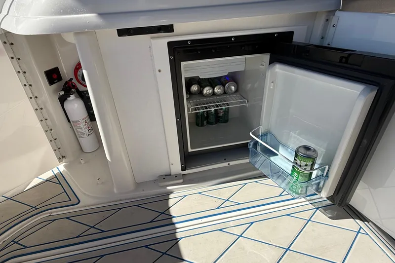 Slide: The Image of 1999 Formula 280 Sun Sport cabin interior with beige seating and modern amenities. - 19