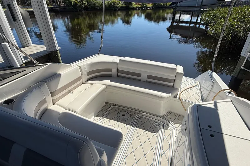 Slide: The Image of 1999 Formula 280 Sun Sport boat cruising on a scenic river with lush greenery. - 2