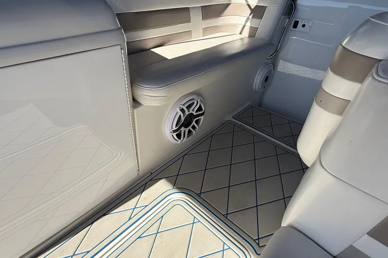 Slide: The Image of 1999 Formula 280 Sun Sport boat bathroom with sink, toilet, and porthole window. - 20
