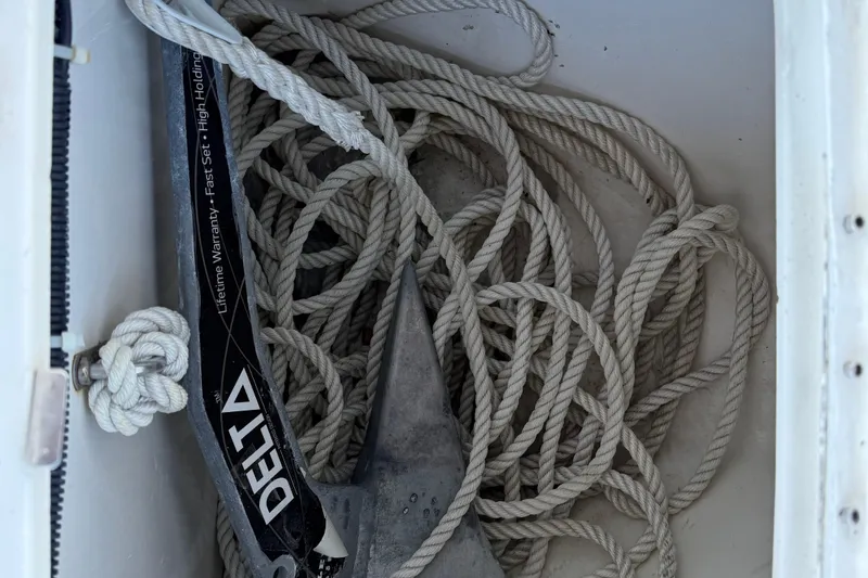 Slide: The Image of Anchor and rope in a 1999 Formula 280 Sun Sport boat compartment. - 27