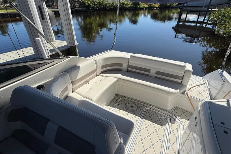 Slide: The Image of 1999 Formula 280 Sun Sport boat docked in a marina, featuring a sleek blue design. - 3