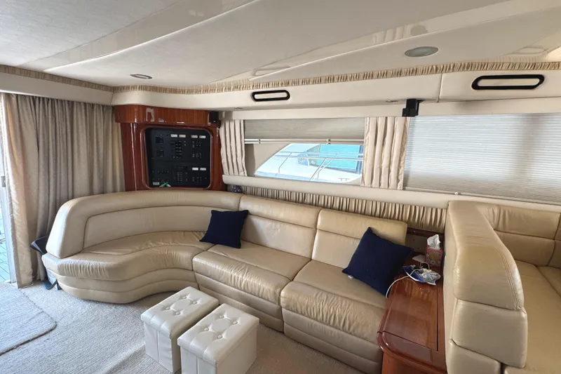Slide: The Image of Luxurious interior of 2004 Sea Ray 560 Sedan Bridge yacht with cream leather seating. - 16