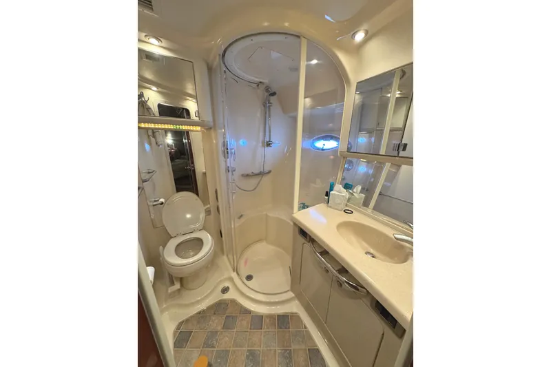 Slide: The Image of Luxurious bathroom in 2004 Sea Ray 560 Sedan Bridge yacht with shower and vanity. - 21