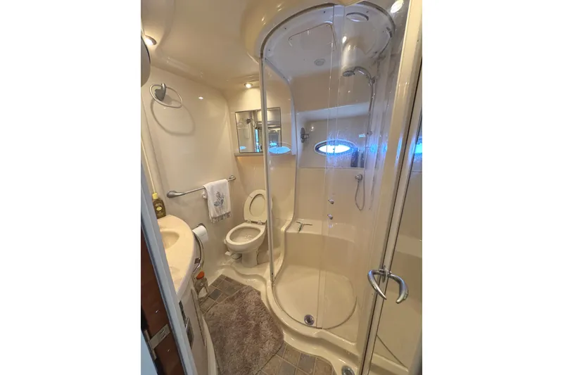Slide: The Image of Luxurious bathroom in 2004 Sea Ray 560 Sedan Bridge yacht with shower and toilet. - 27