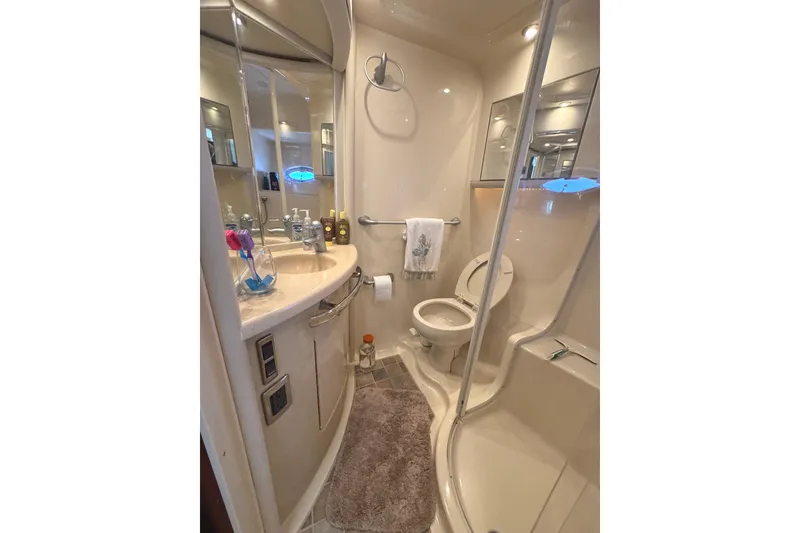 Slide: The Image of Luxurious bathroom in 2004 Sea Ray 560 Sedan Bridge yacht, featuring modern amenities and elegant design. - 28