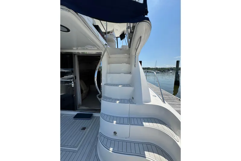 Slide: The Image of Staircase on 2004 Sea Ray 560 Sedan Bridge yacht, leading to upper deck. - 35