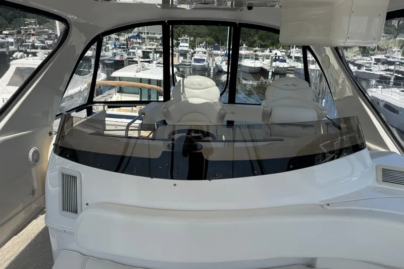 Slide: The Image of Interior view of 2004 Sea Ray 560 Sedan Bridge yacht at marina. - 39