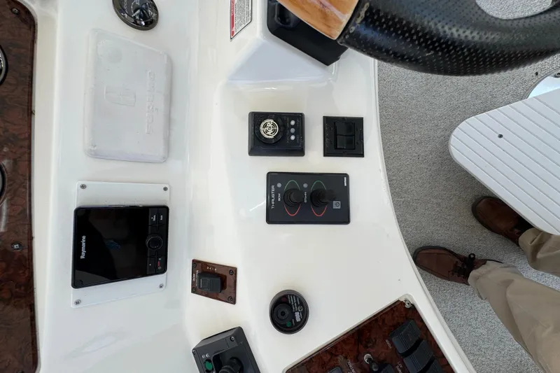 Slide: The Image of Control panel of a 2004 Sea Ray 560 Sedan Bridge yacht with various navigation instruments. - 46