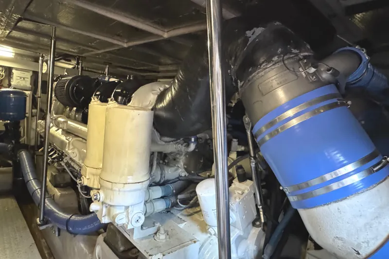 Slide: The Image of Engine room of 2004 Sea Ray 560 Sedan Bridge with visible machinery and components. - 58