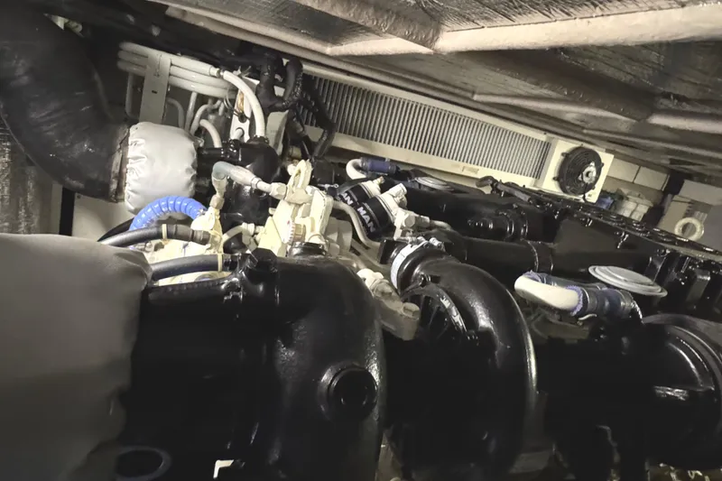 Slide: The Image of Engine room of a 2004 Sea Ray 560 Sedan Bridge yacht, showcasing mechanical components. - 59