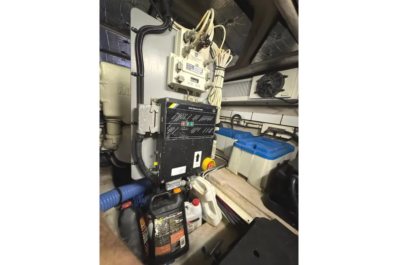 Slide: The Image of Engine room of 2004 Sea Ray 560 Sedan Bridge with electrical panel and equipment. - 65