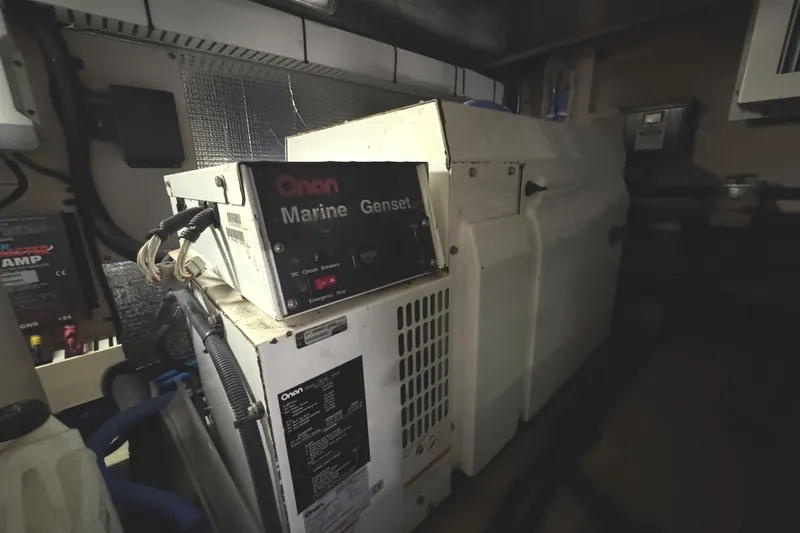 Slide: The Image of Engine room of 2004 Sea Ray 560 Sedan Bridge with Onan Marine Genset. - 68