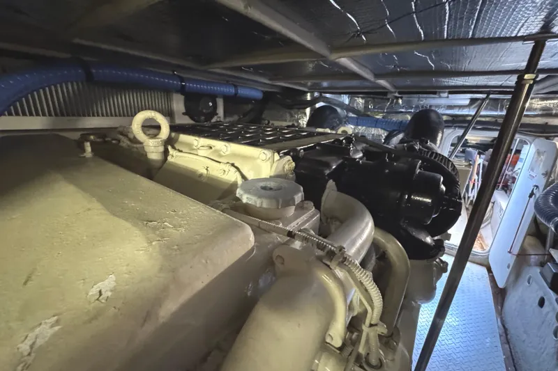 Slide: The Image of Engine room of 2004 Sea Ray 560 Sedan Bridge yacht, showcasing mechanical components. - 70