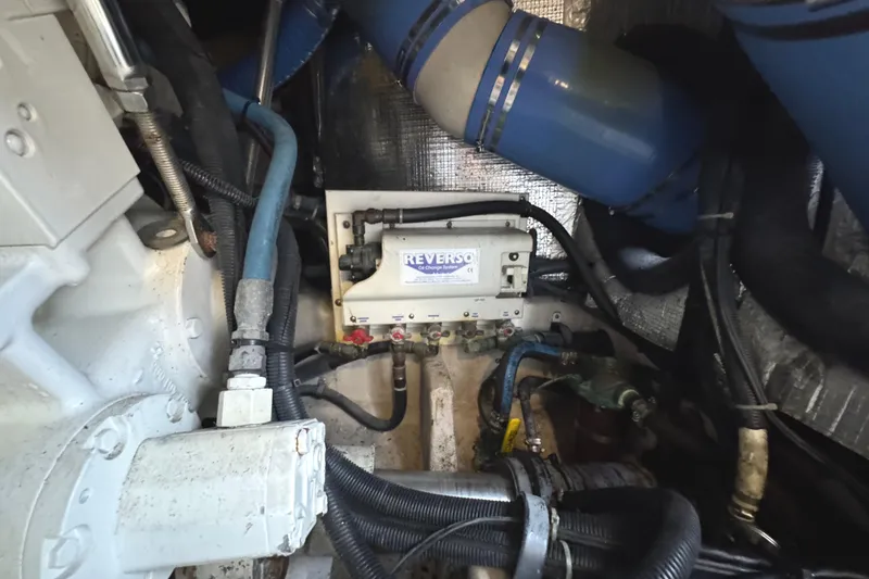 Slide: The Image of Engine room of 2004 Sea Ray 560 Sedan Bridge with Reverso oil change system. - 72