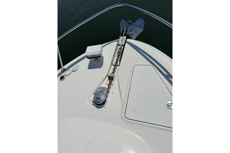 Slide: The Image of Bow of 2004 Sea Ray 560 Sedan Bridge with anchor and winch system. - 79