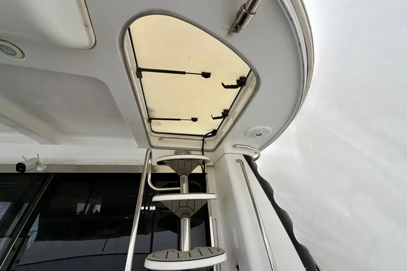 Slide: The Image of Interior view of 1999 Carver 530 Voyager Pilothouse with ladder and hatch. - 33
