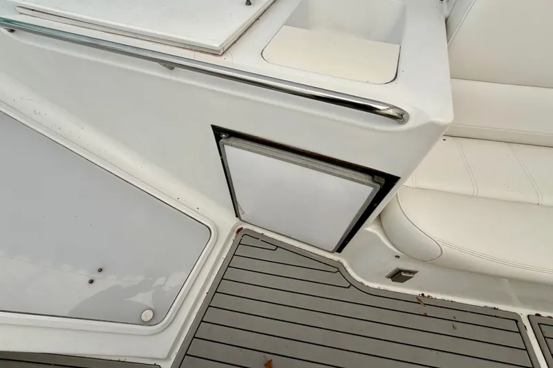 Slide: The Image of 1999 Carver 530 Voyager Pilothouse deck with seating and storage compartment. - 41