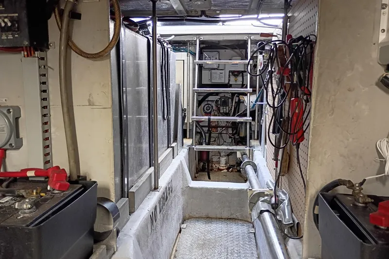 Slide: The Image of Engine room of 1999 Carver 530 Voyager Pilothouse with equipment and wiring. - 44