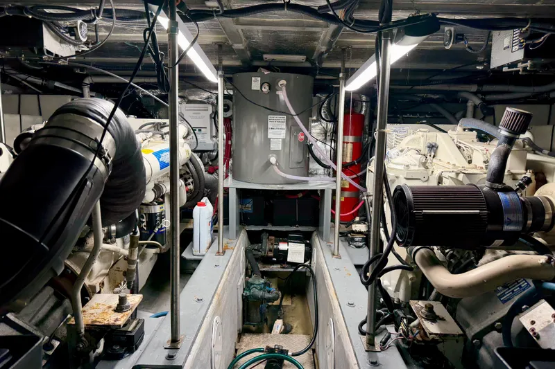 Slide: The Image of Engine room of a 1999 Carver 530 Voyager Pilothouse, showcasing machinery and equipment. - 45