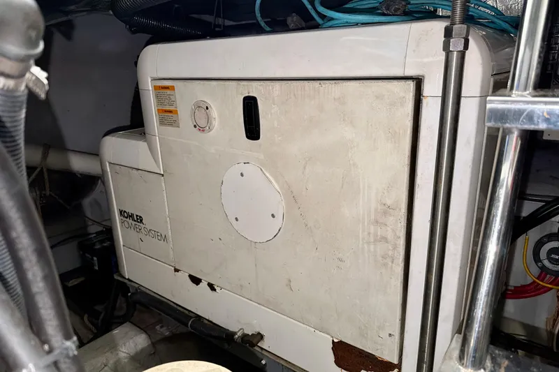 Slide: The Image of Kohler power system in 1999 Carver 530 Voyager Pilothouse engine room. - 47