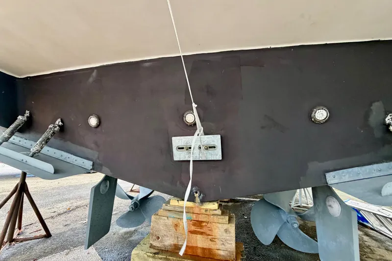 Slide: The Image of 1999 Carver 530 Voyager Pilothouse boat hull and propellers on dry dock. - 51