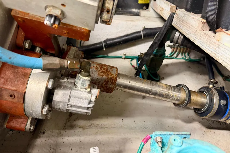 Slide: The Image of Engine compartment of a 1999 Carver 530 Voyager Pilothouse with visible mechanical components. - 60