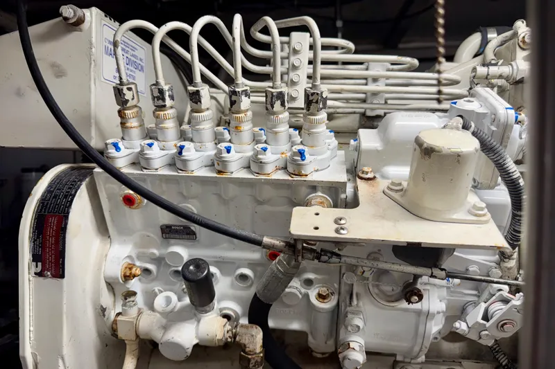 Slide: The Image of Engine components of a 1999 Carver 530 Voyager Pilothouse, showcasing intricate mechanical details. - 61