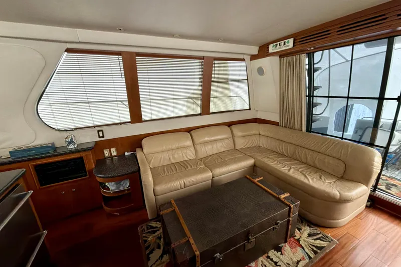 Slide: The Image of Luxurious interior of 1999 Carver 530 Voyager Pilothouse with leather seating and wooden accents. - 12