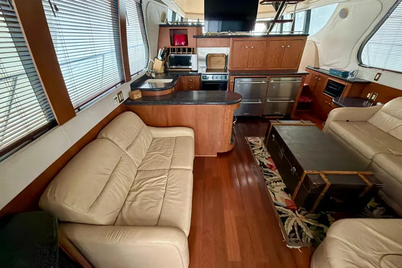 Slide: The Image of Luxurious interior of 1999 Carver 530 Voyager Pilothouse with leather seating and modern kitchen. - 13