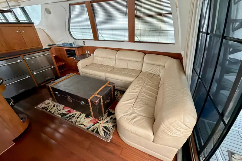 Slide: The Image of Luxurious interior of 1999 Carver 530 Voyager Pilothouse with leather sofa and vintage trunk. - 14