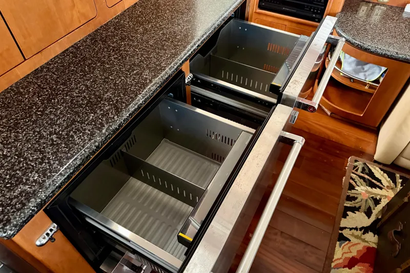 Slide: The Image of Kitchen drawers in 1999 Carver 530 Voyager Pilothouse with granite countertop. - 18