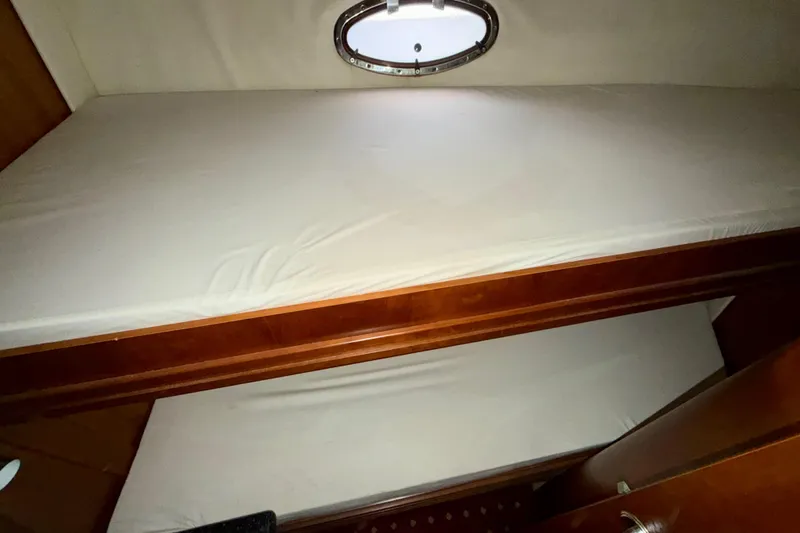 Slide: The Image of Bunk beds in 1999 Carver 530 Voyager Pilothouse with porthole window. - 22