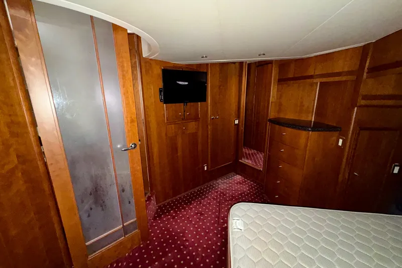 Slide: The Image of Interior of 1999 Carver 530 Voyager Pilothouse with wood paneling and carpeted floor. - 28