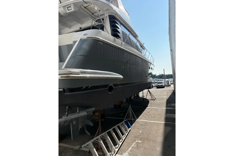 Slide: The Image of 1999 Carver 530 Voyager Pilothouse yacht on dry dock, side view. - 3