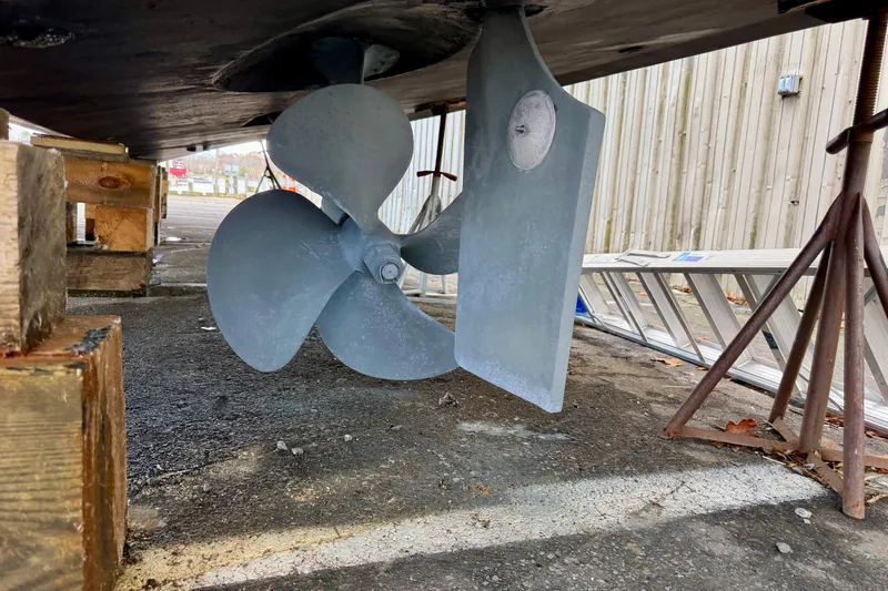 Slide: The Image of 1999 Carver 530 Voyager Pilothouse propeller and rudder in dry dock. - 50