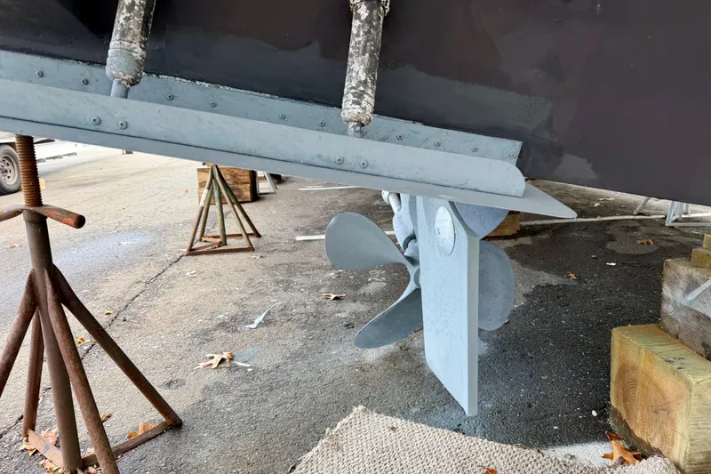 Slide: The Image of Propeller and rudder of 1999 Carver 530 Voyager Pilothouse on dry dock. - 53