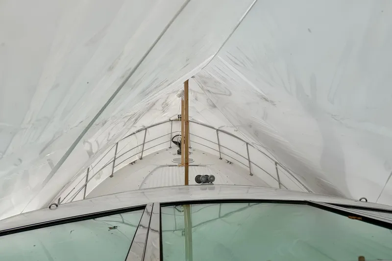 Slide: The Image of 1999 Carver 530 Voyager Pilothouse yacht under protective cover, view from the deck. - 55