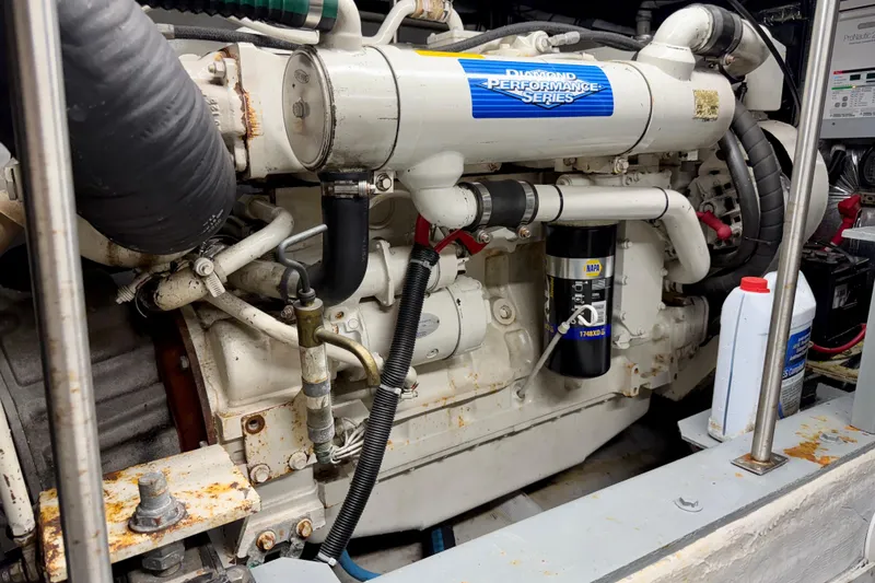 Slide: The Image of Engine room of 1999 Carver 530 Voyager Pilothouse with Diamond Performance Series engine. - 58
