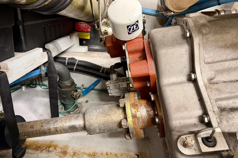 Slide: The Image of Engine compartment of a 1999 Carver 530 Voyager Pilothouse with visible mechanical components. - 59