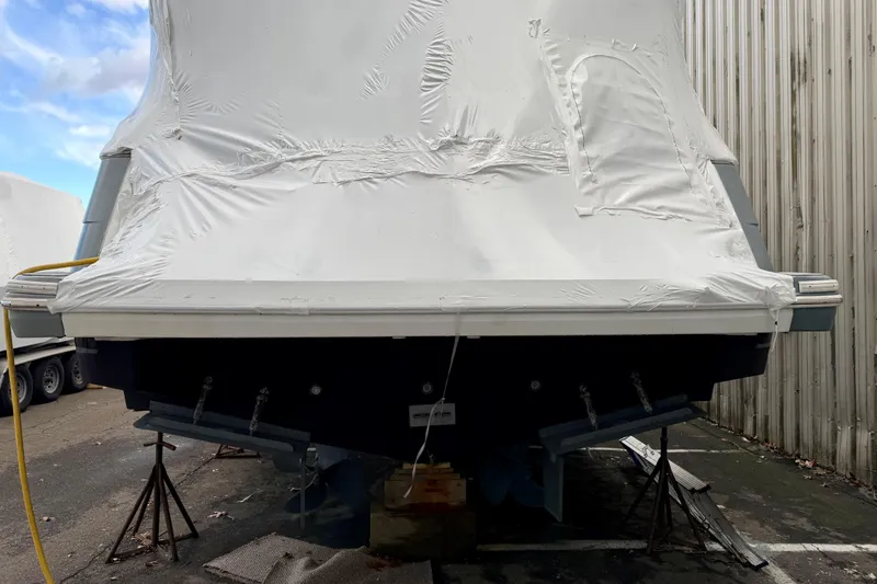 Slide: The Image of 1999 Carver 530 Voyager Pilothouse covered in protective wrap, stored outdoors. - 9
