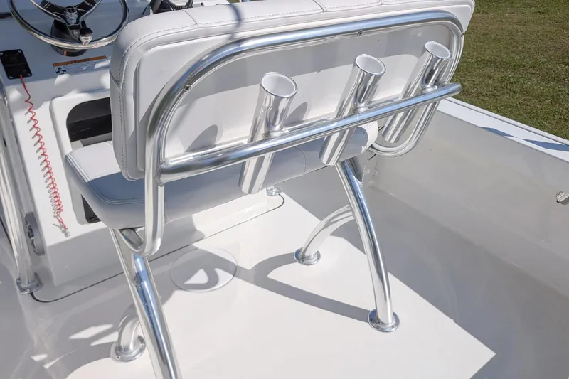 Slide: The Image of 2026 Parker 18SE Center Console boat with sleek aluminum rod holders and cushioned seating. - 10
