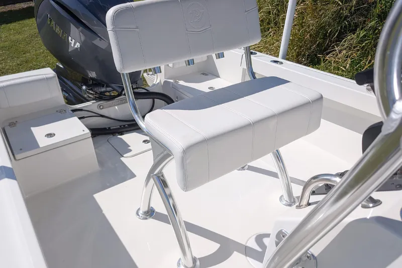Slide: The Image of 2026 Parker 18SE Center Console boat with white seating and Yamaha engine. - 12