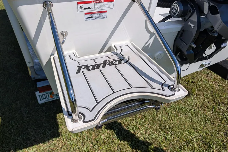 Slide: The Image of 2026 Parker 18SE Center Console boat swim platform with stainless steel rails. - 13