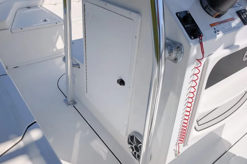 Slide: The Image of 2026 Parker 18SE Center Console boat interior with control panel and safety features. - 16