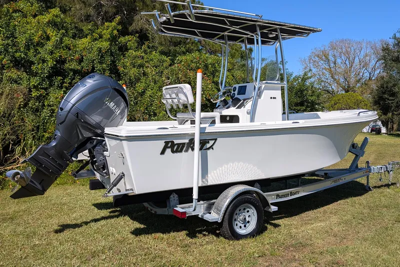 Slide: The Image of 2026 Parker 18SE Center Console boat on trailer, featuring Yamaha outboard motor. - 2