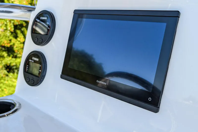 Slide: The Image of Console of 2026 Parker 18SE Center Console with Garmin display and Yamaha gauges. - 7