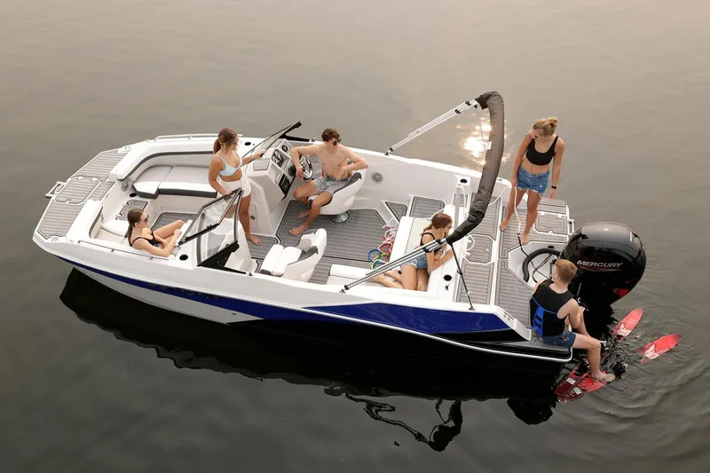 Slide: The Image of Manufacturer Provided Image: 2025 Starcraft SVX 210 OB boat with people enjoying water activities. - 1