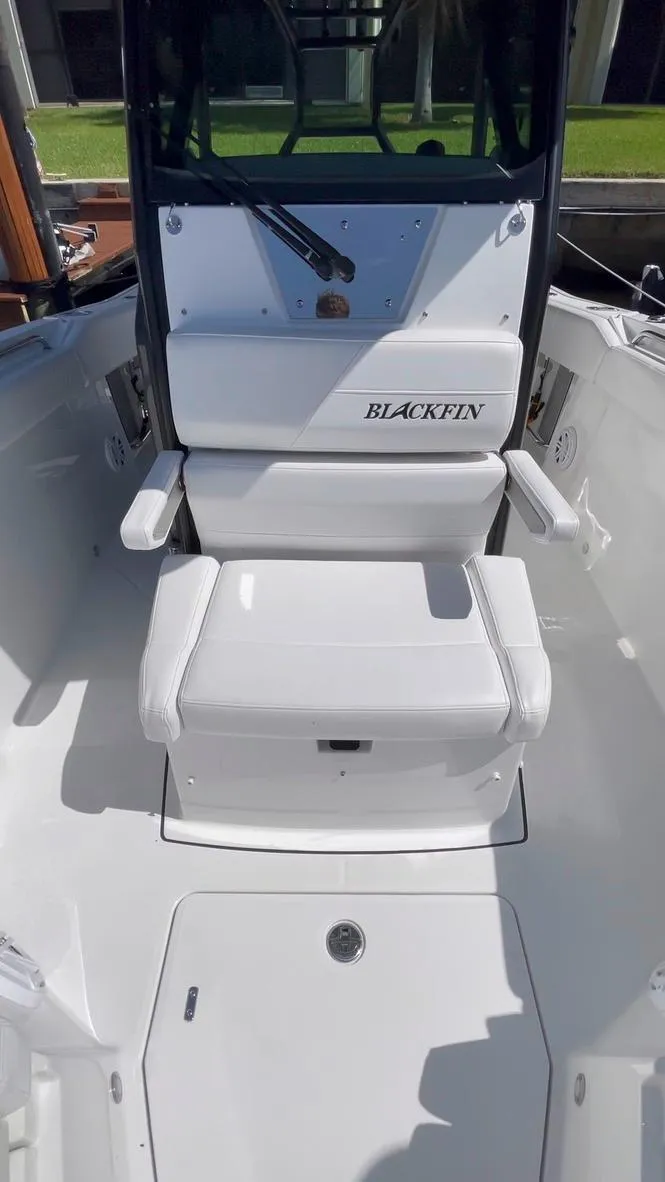 Slide: The Image of 2019 Blackfin 272 CC boat interior with white seating and console. - 37
